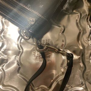 Black shiny leather poppy coach wristlet